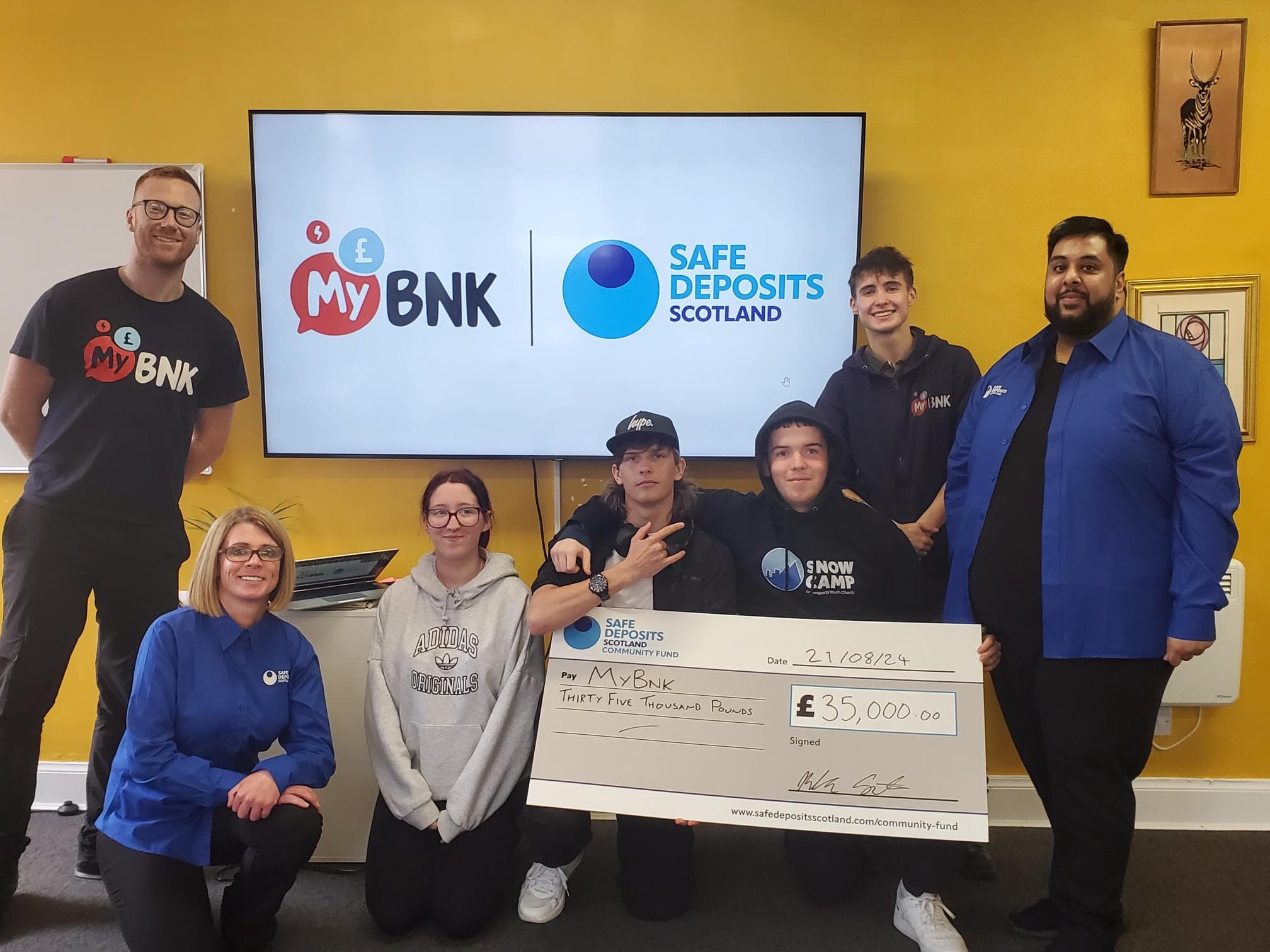 SafeDeposits Scotland team present cheque to financial education charity MyBnk