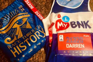 A running bib for MyBnk and a 'race through history' t-shirt provided for the Cairo Half Marathon